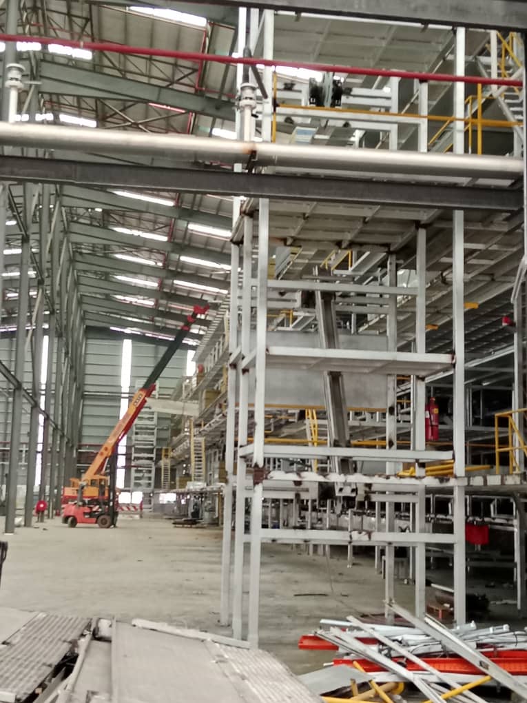 Glove line structure being dismantled and staged for removal