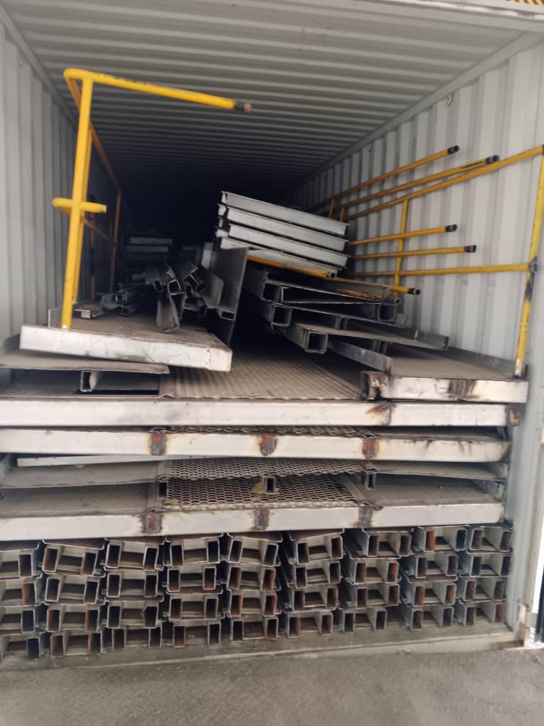 Line components stacked and arranged inside container for export