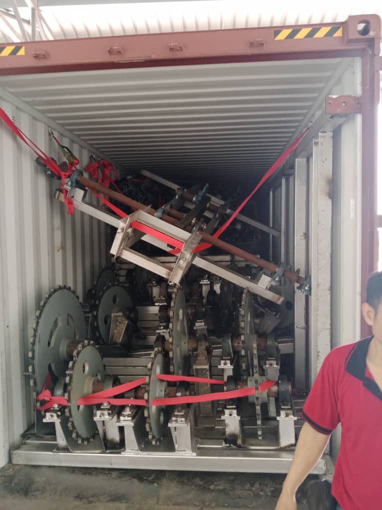 Drive assemblies and chains secured and strapped inside container